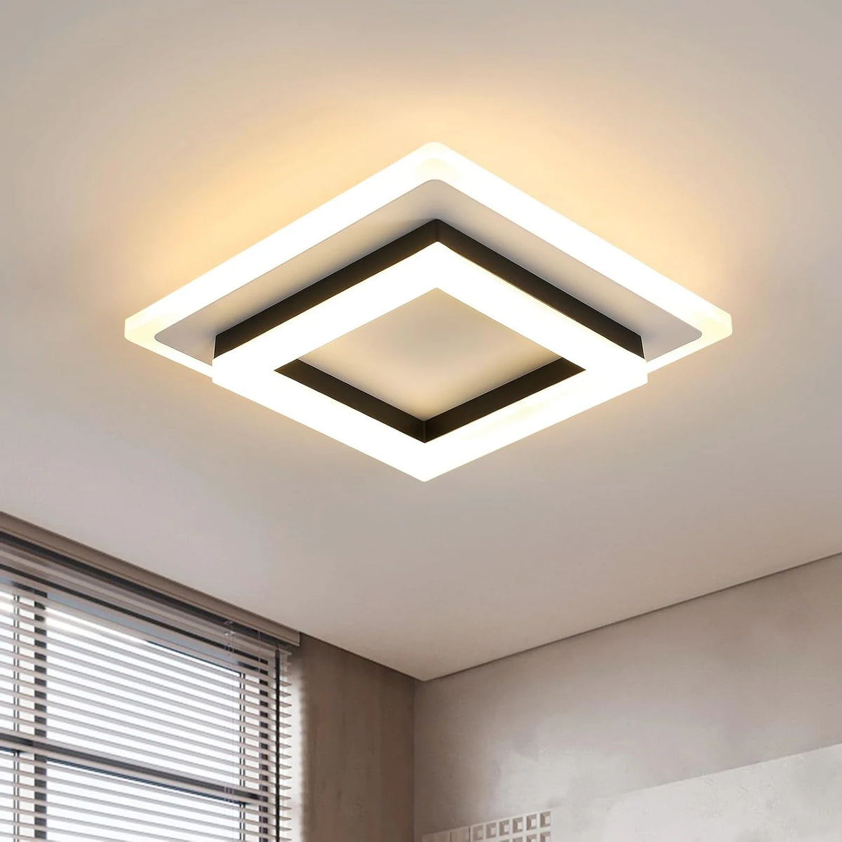Square LED flush ceiling light with white frame and black inner ring, warm glow