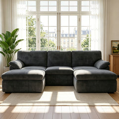 Dark gray convertible sofa bed with removable armrests and chaise sections