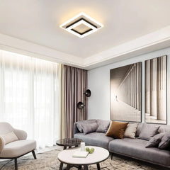 Square LED flush ceiling light with white border and black inset, warm white