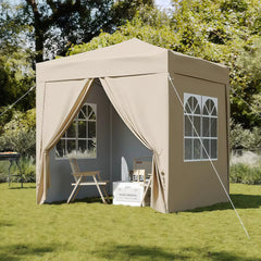 Pop-up gazebo canopy tent in beige with mesh window panels and draped curtains