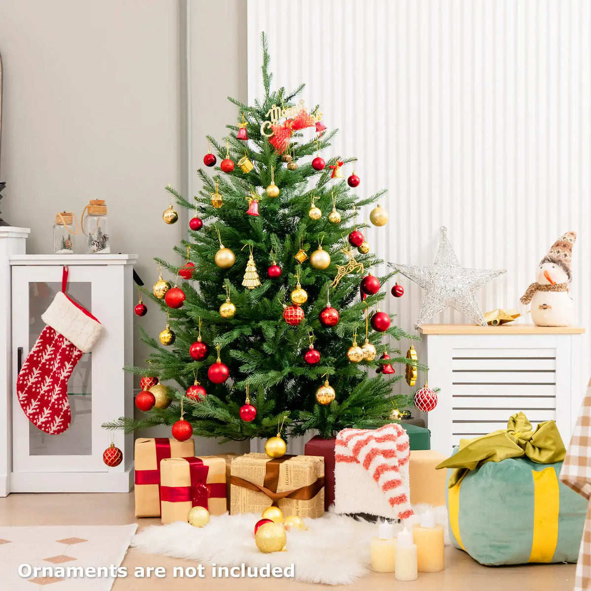 Artificial Christmas tree with warm LED lights, red and gold baubles, star topper