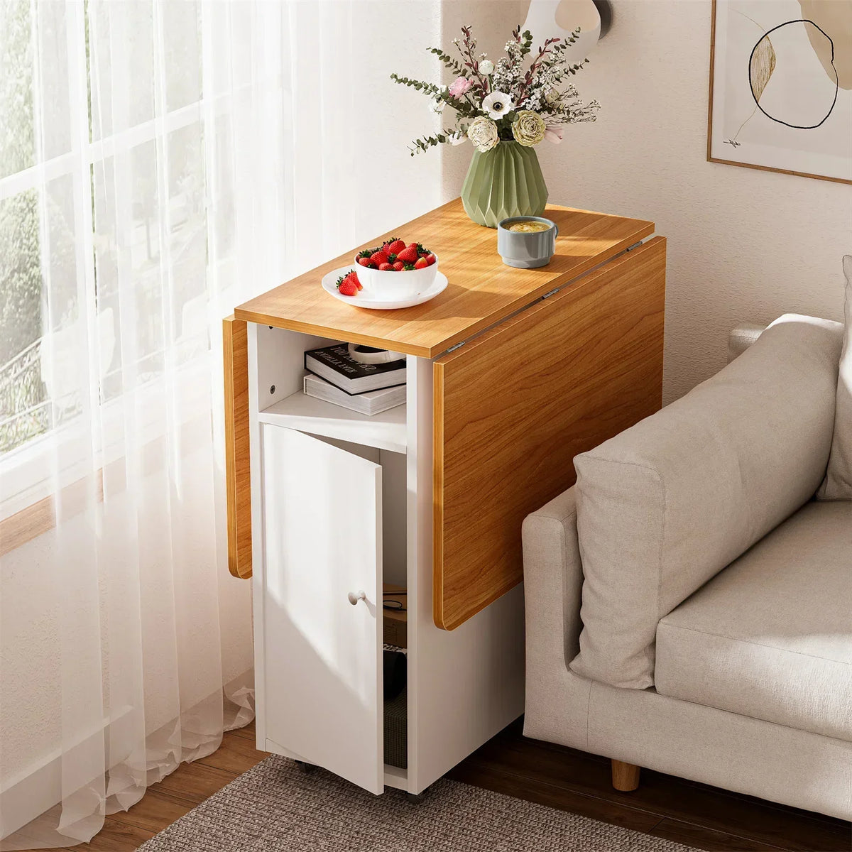 Wood-and-white compact folding table with cabinet door and open shelf storage on wheels