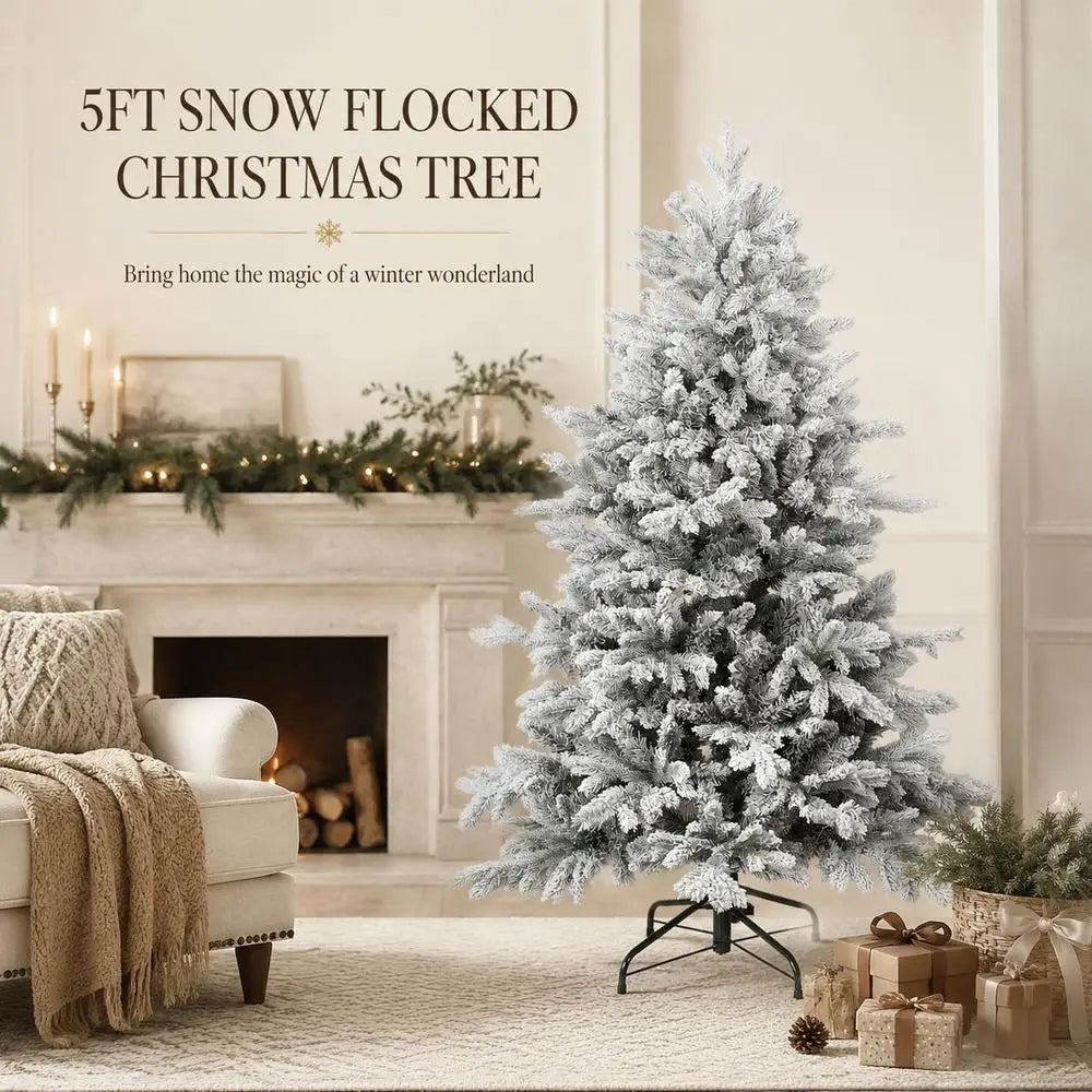 Snow-flocked artificial Christmas tree with full, white branches on a metal stand