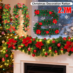 Red LED rattan garland with green foliage, poinsettias, red berries, warm lights