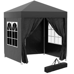 Dark gray pop-up gazebo tent with black curtains, window panels, and carry bag