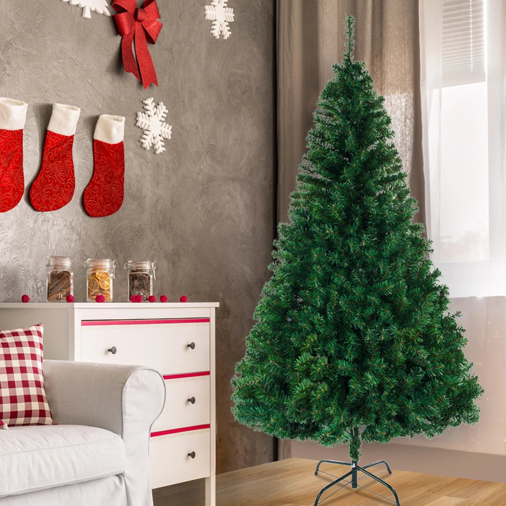 Artificial Christmas tree with dense green hinged-needle branches on metal stand
