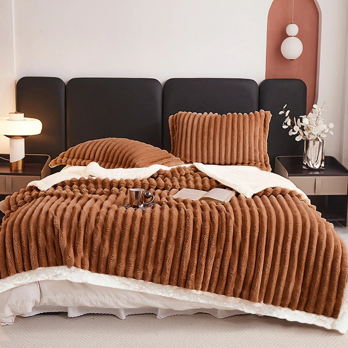 Brown weighted fleece blanket with chunky ribbed texture and white plush edge