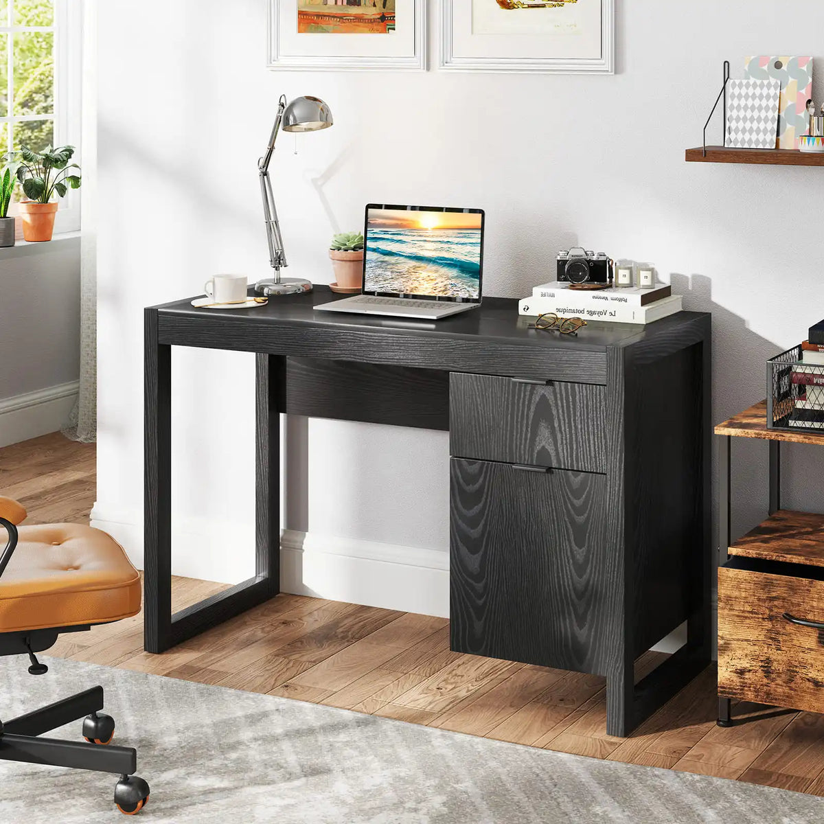 Black wooden computer desk with side storage cabinet drawer and open leg frame