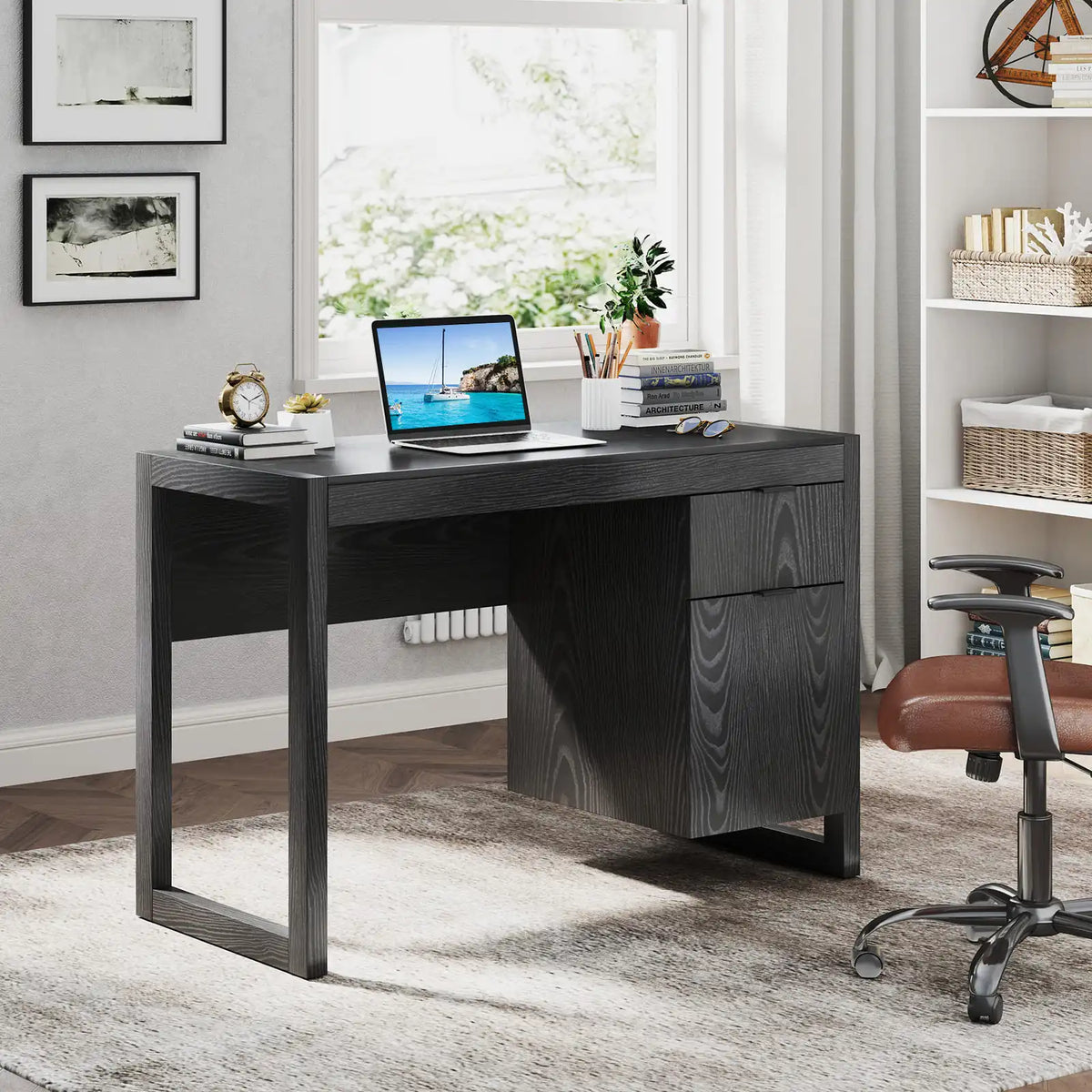 Black wooden computer desk with wide tabletop and right-side storage drawers