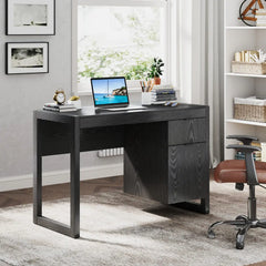 Black wooden computer desk with wide tabletop and right-side storage drawers