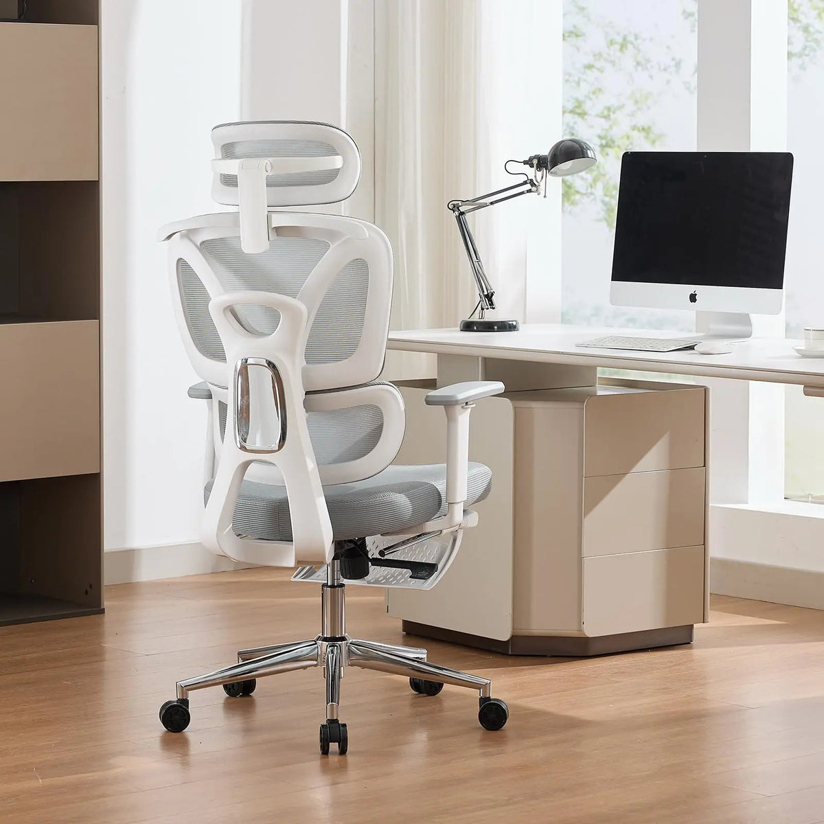 White mesh ergonomic office chair with headrest and armrests on a wheeled base