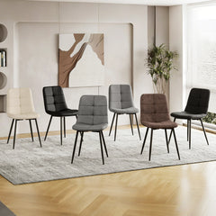 Dining table with mix of upholstered chairs, gray and brown seats with black metal legs
