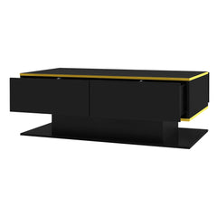 Black coffee table with gold trim, closed drawer fronts, and open shelf base