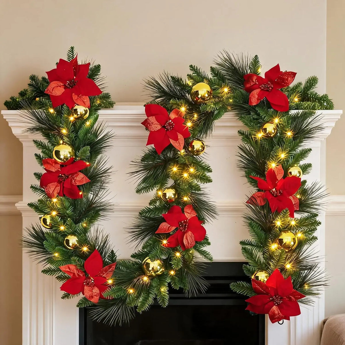 Rustic pine vine Christmas wreath with red poinsettias and glowing warm lights