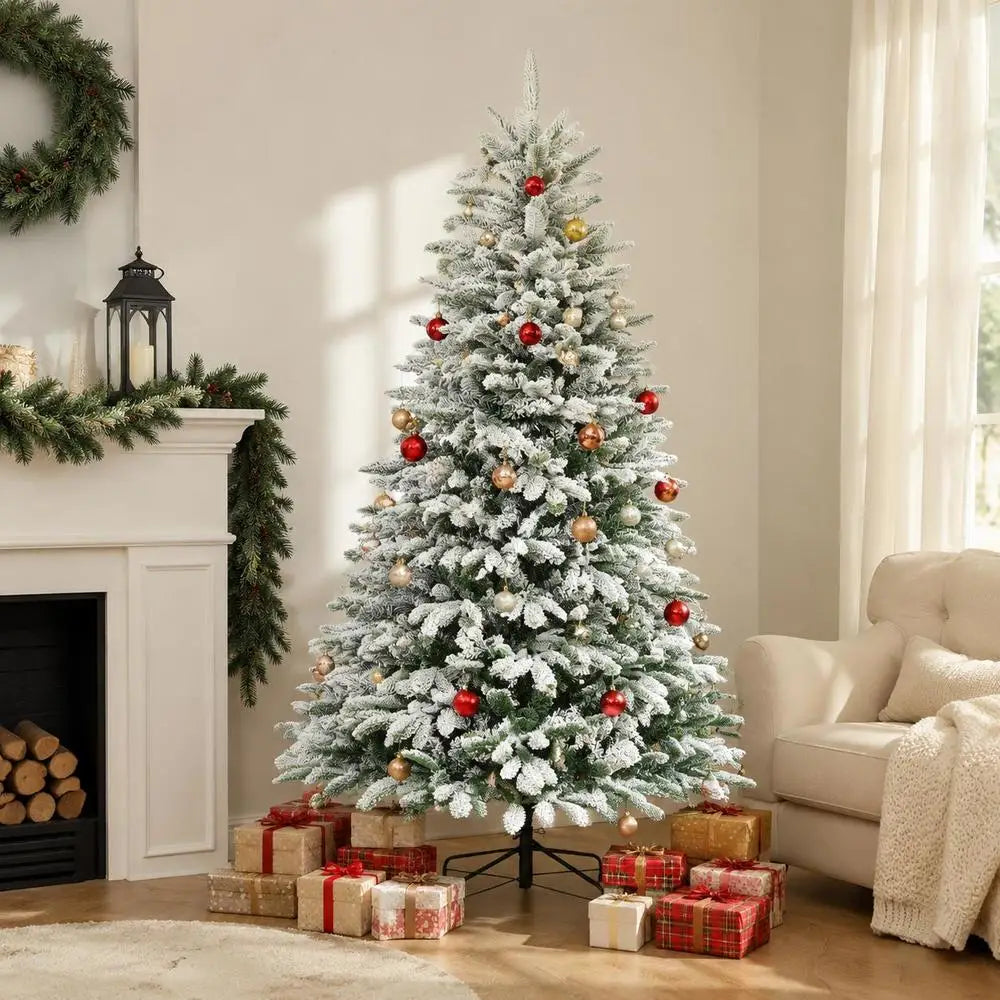 Artificial flocked Christmas tree with red ornaments and gold baubles, on metal stand