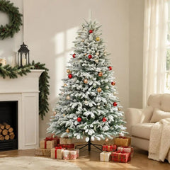 Artificial flocked Christmas tree with red ornaments and gold baubles, on metal stand