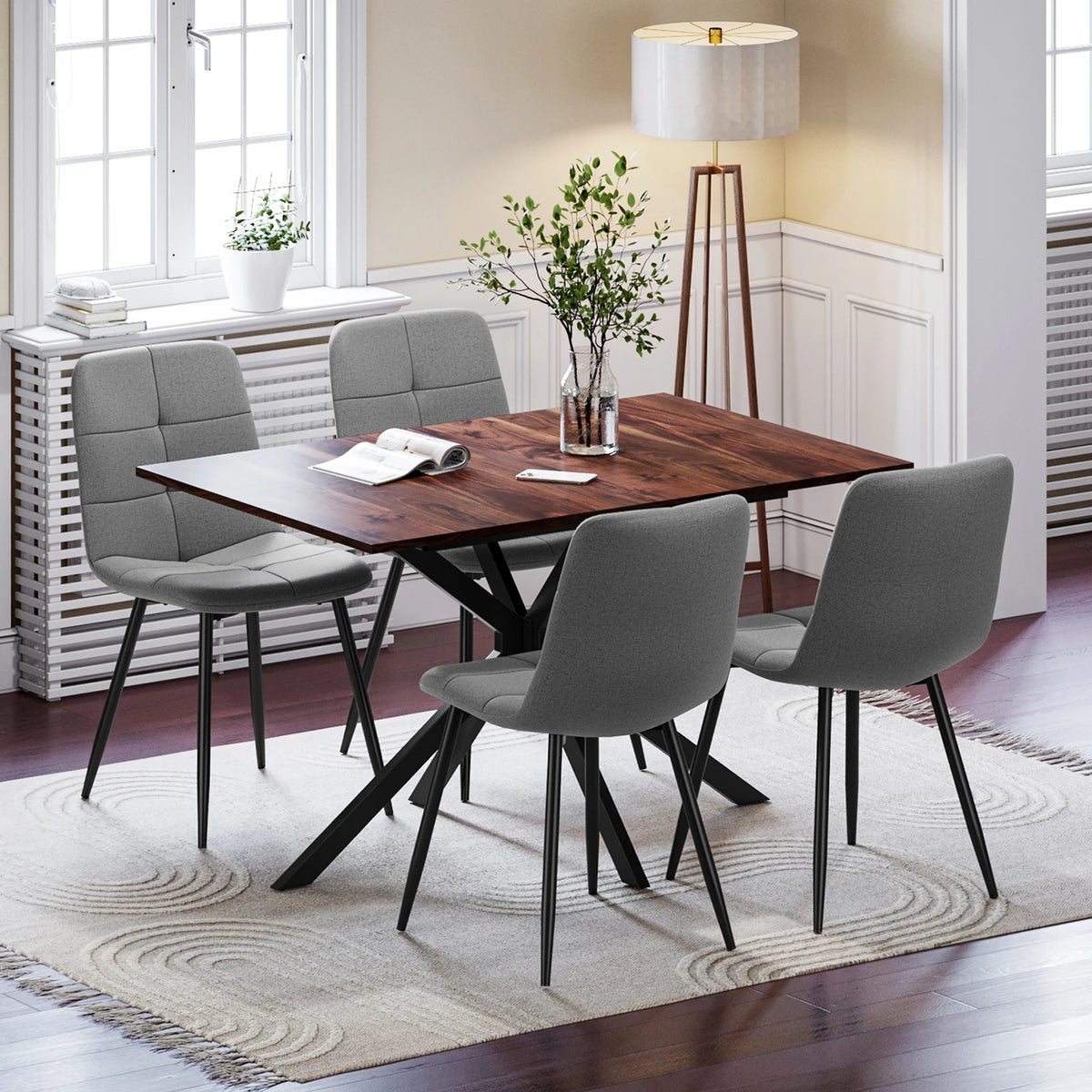 Rectangular extendable dining table with dark wood top and 4 upholstered black chairs