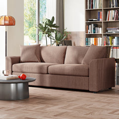 Coffee-brown upholstered cord sofa with three back cushions and wide track arms