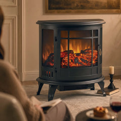 Black electric fireplace stove with glass front and realistic flames, front view