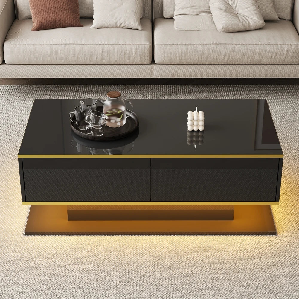 Black coffee table with gold trim stripe, two drawers, and open storage shelf