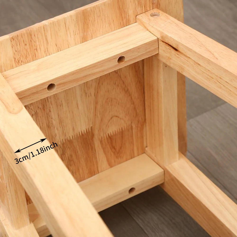 Natural wood stool frame with slatted footrest and cross braces