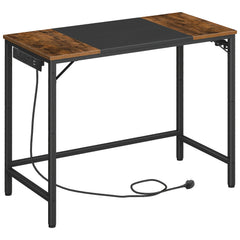 Modern computer desk with brown top, black metal frame, and cable routed along the side