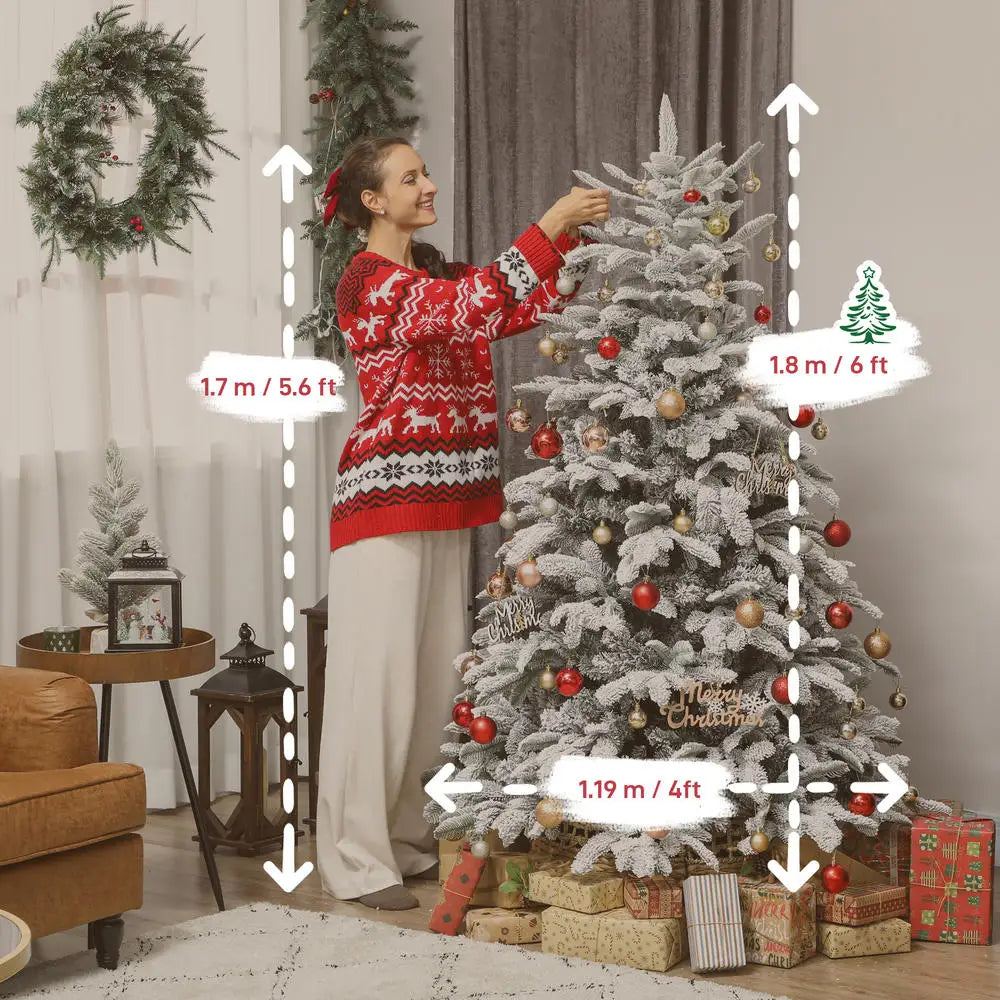 Artificial flocked Christmas tree decorated with red and gold ornaments, topped and supported