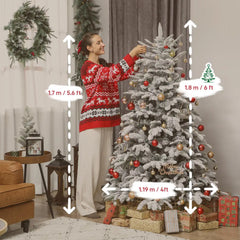 Artificial flocked Christmas tree decorated with red and gold ornaments, topped and supported