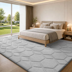 Light gray geometric area rug with embossed hexagon pattern, low-pile textured finish