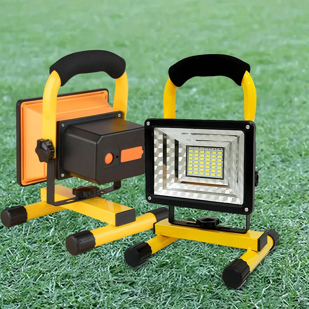 Portable LED flood light with yellow stand, black frame, and side controls on the housing