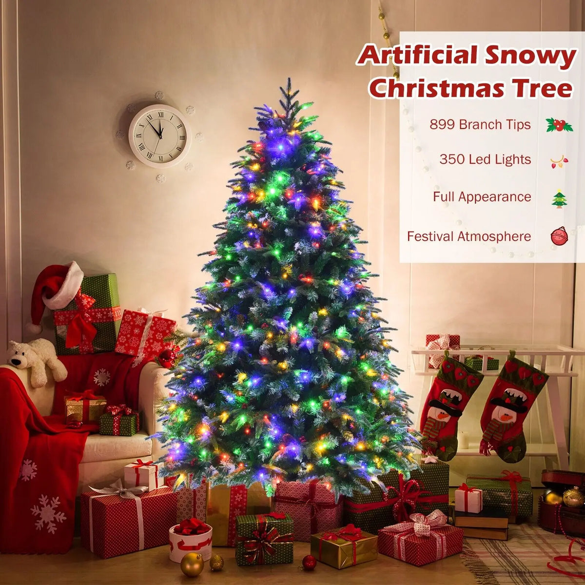 Snowy artificial Christmas tree with multicolor LED lights and gift decorations at the base