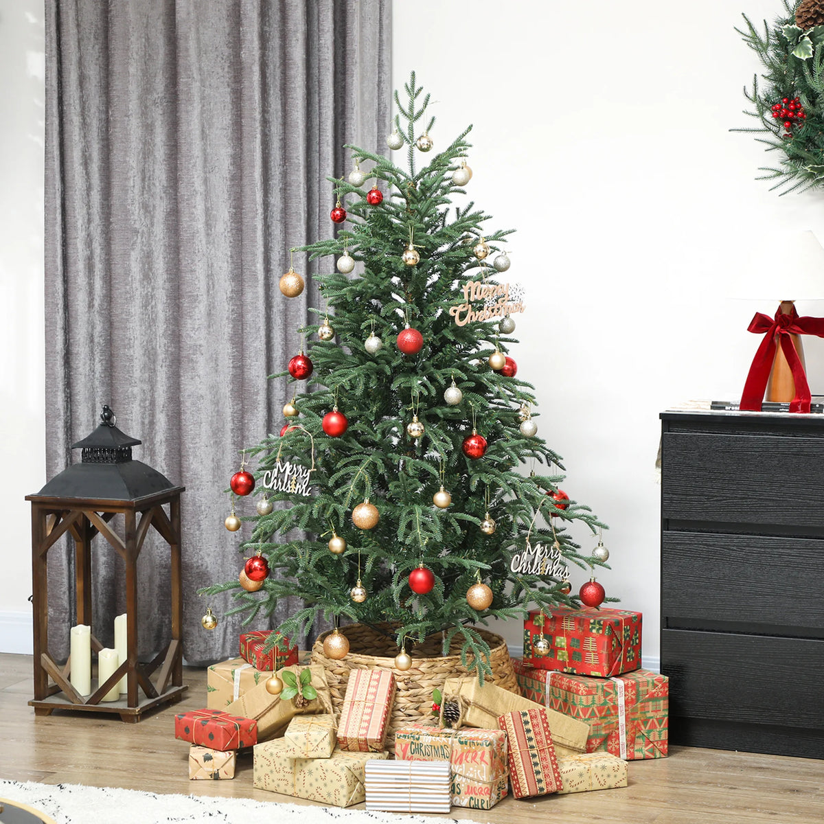 Artificial green spruce Christmas tree with red, gold, and white ornaments and lights