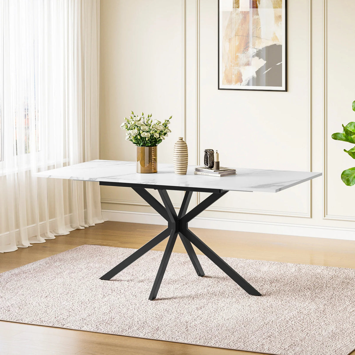 Rectangular extendable dining table with light tabletop and black X legs.