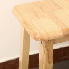 Natural wood stool seat edge with smooth rounded corner