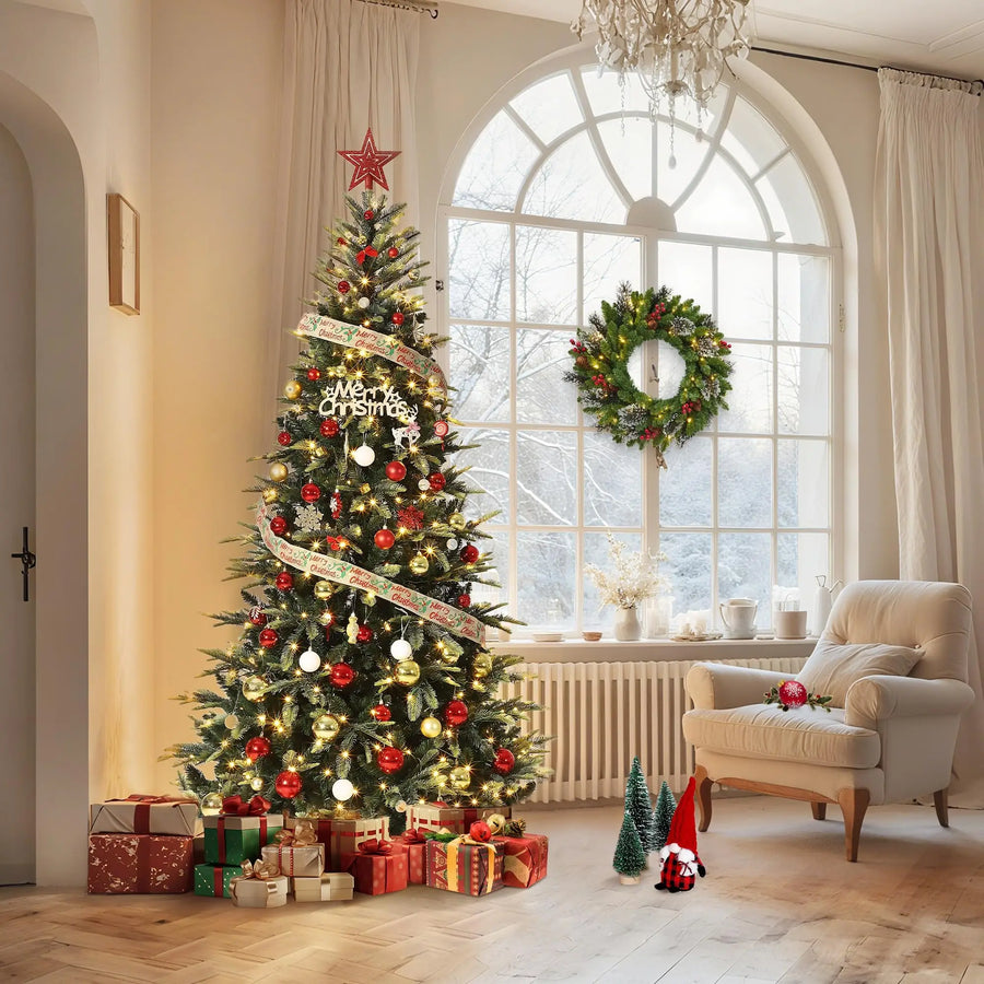Pre-lit pencil Christmas tree with warm white lights and red-gold ornaments on stand