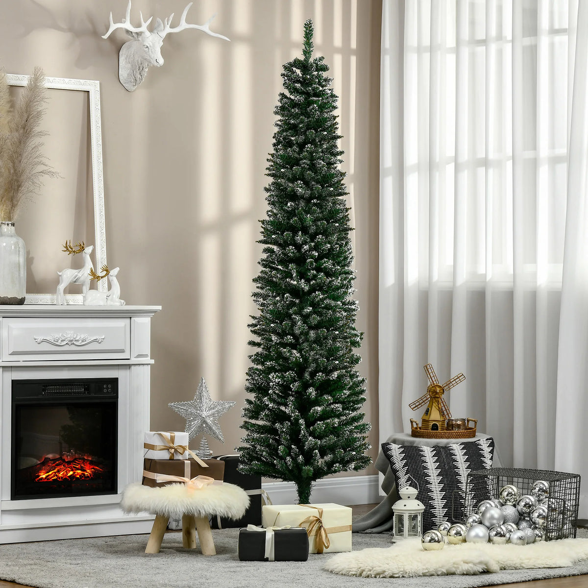 Artificial snow-dipped Christmas pencil tree, green with silver ornaments and white flocking