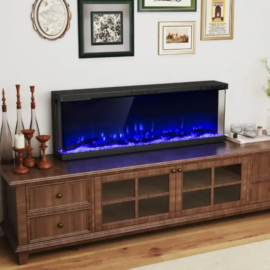 Black electric fireplace with blue flame effect in a wood media console