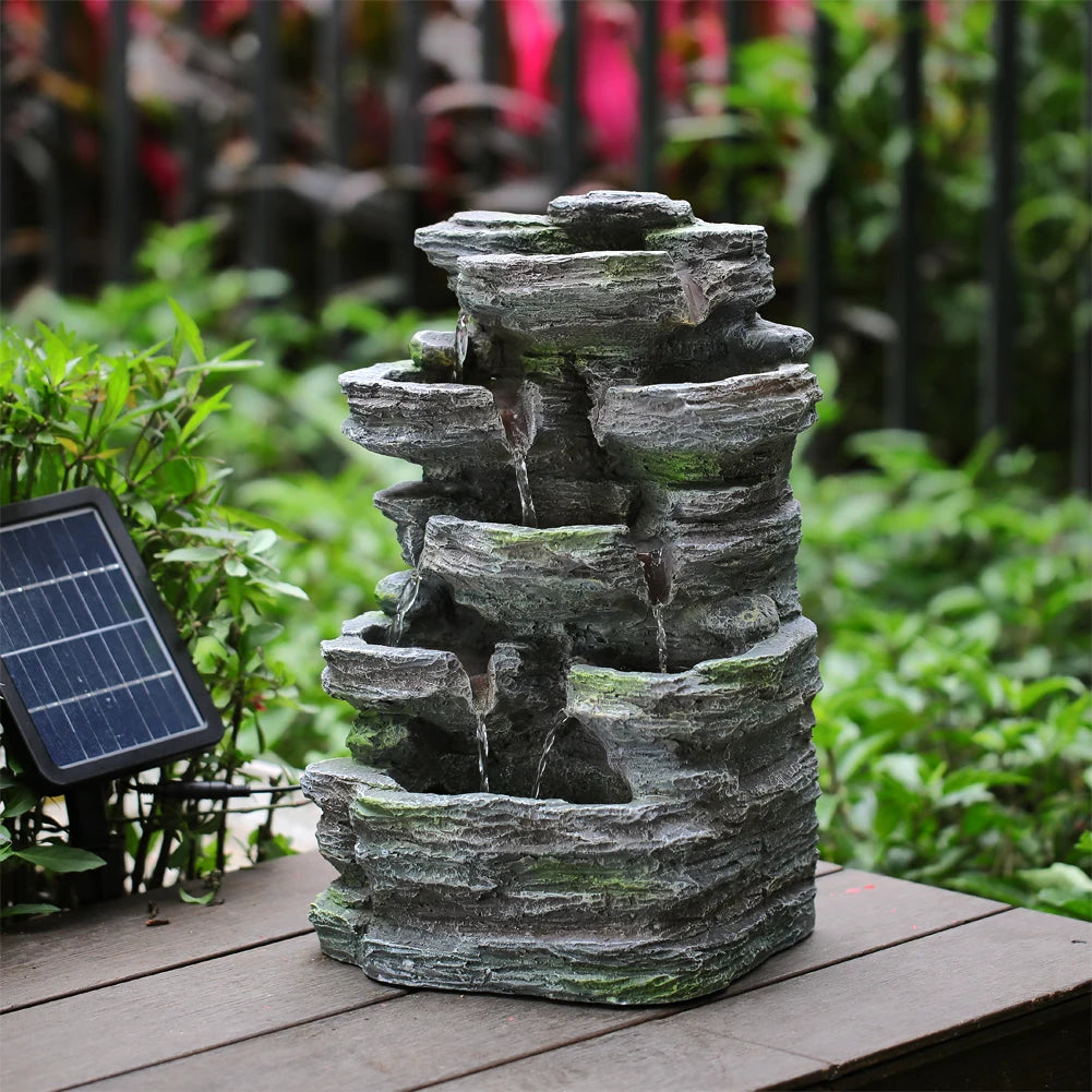 Grey faux rock garden fountain with stacked stone look and small top spout