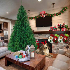 Green artificial Christmas tree with metal stand and dense branch tips for ornaments