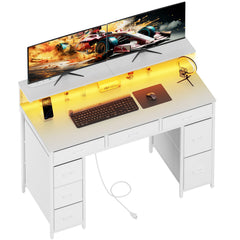 White computer desk with adjustable monitor stand and front power outlet
