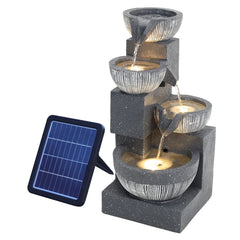 Solar outdoor rockery fountain with pump, dark gray stone tiers, lit bowls and blue solar panel