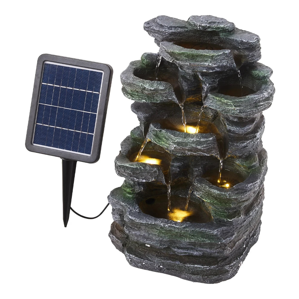 Grey faux rock garden fountain with glowing LED lights and solar panel stake
