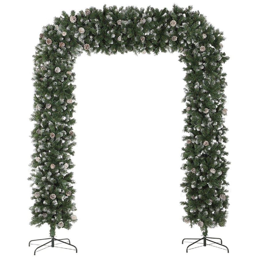 Snow-frosted Christmas tree arch with pinecones and white-tipped foliage, free-standing frame