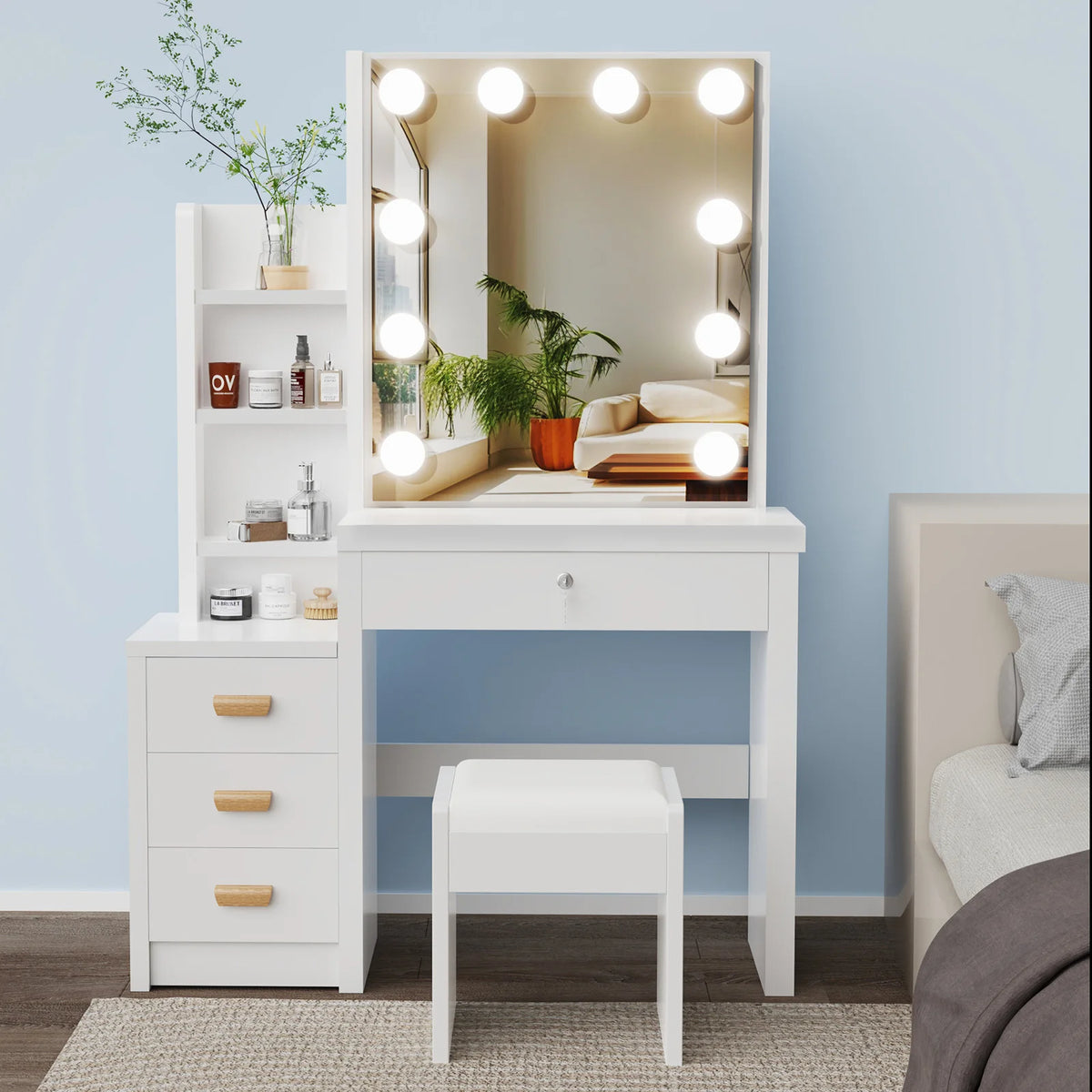 White vanity dressing table with LED bulbs around mirror, storage drawers, and cushioned stool