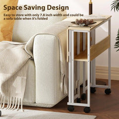 Foldable computer desk on wheels with light wood top and side storage shelf