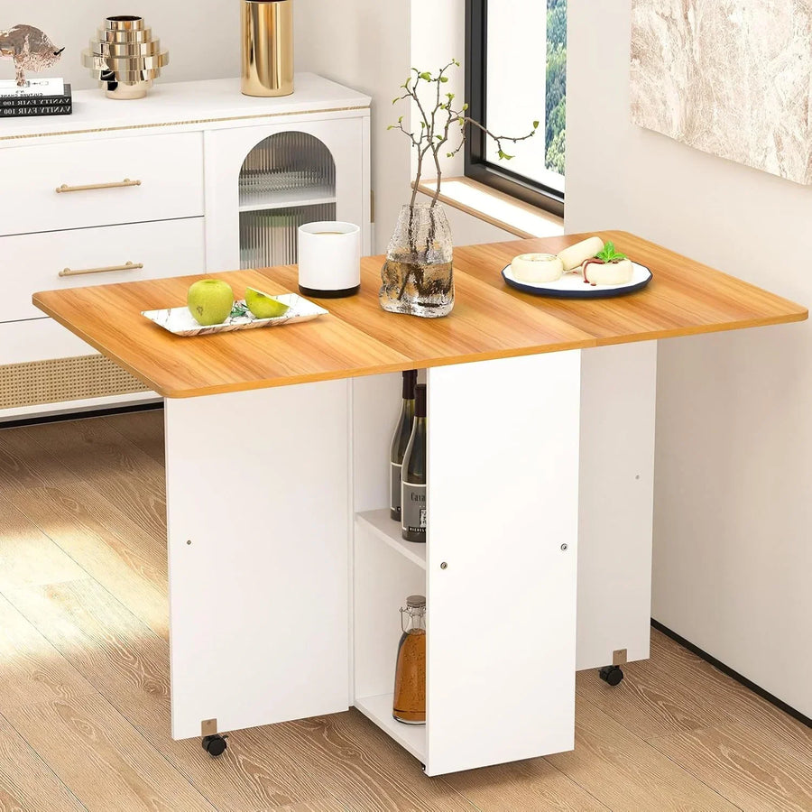 Retractable folding table with light wood top, open side shelf, and rolling caster wheels