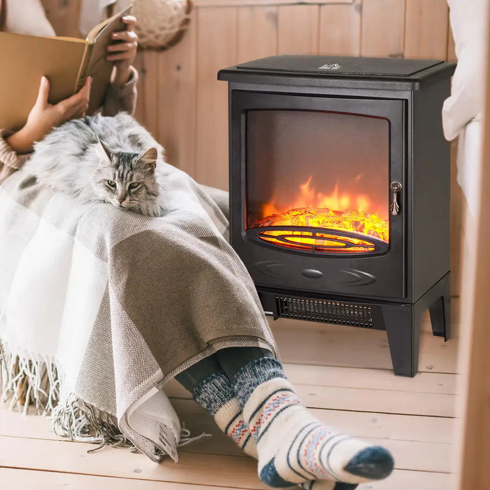 Black freestanding electric fireplace with clear glass flame window and glowing logs.