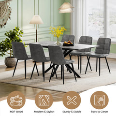 Rectangular extendable dining table with dark tabletop and black X-frame base.