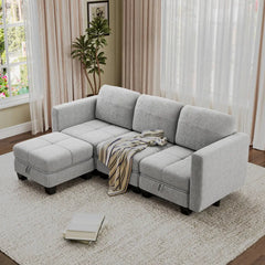 Light gray fabric sectional sofa with chaise ottoman and layered throw blanket