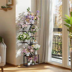 Tree-shaped 7-tier metal plant stand with assorted potted flowers near a window